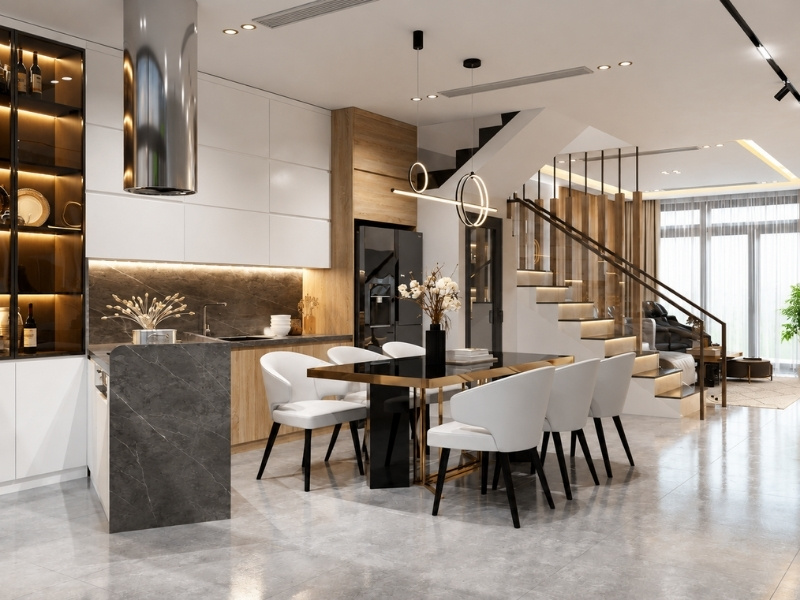 Bếp ăn nhà phố 5x20m sử dụng bàn đảo đá xám ngăn chia khu nấu nướng và bàn ăn