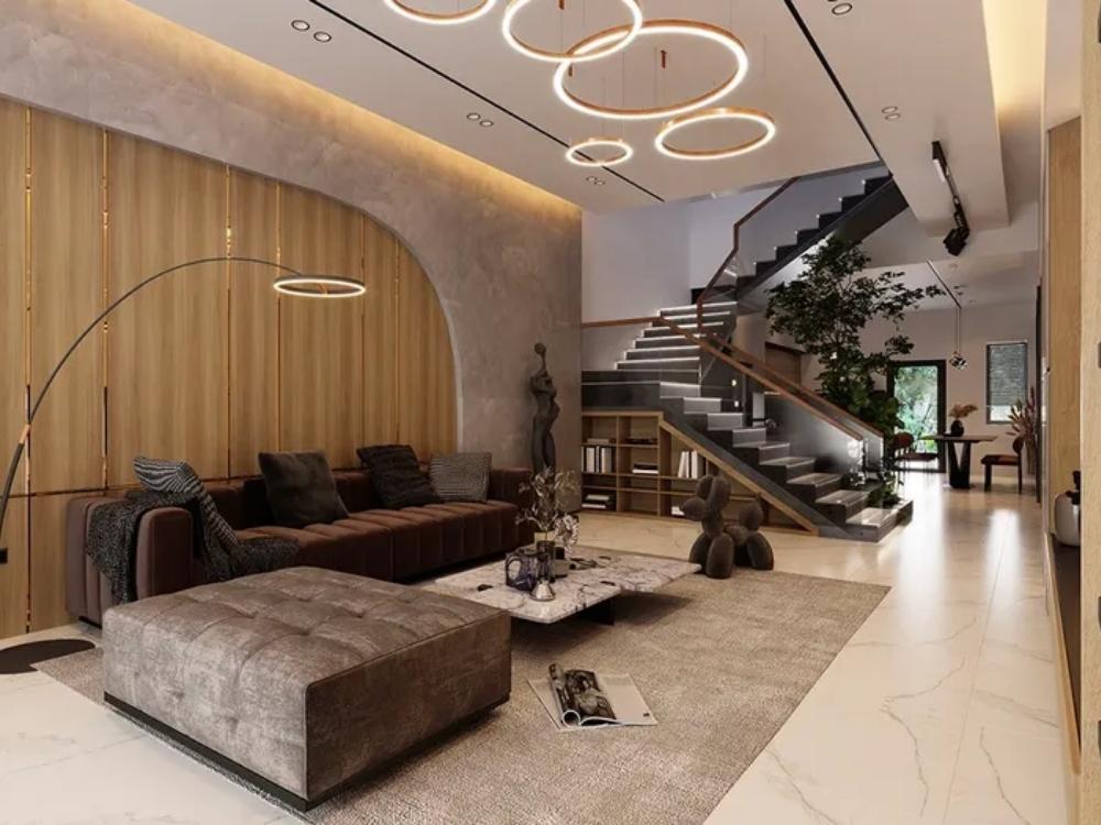 Phòng khách biệt thự tân cổ điển với sofa vải, bàn trà gỗ và đèn công nghiệp mang đến không gian trang nhã, lịch lãm