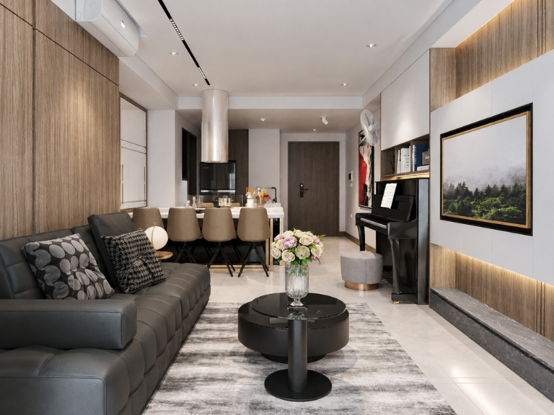 Không gian mở phòng khách liền bếp nhà phố với sofa da đen và đảo bếp hiện đại