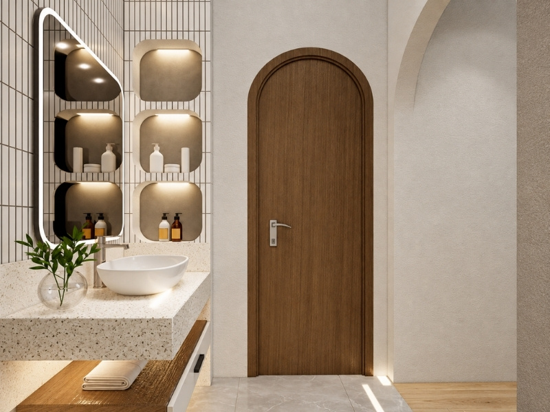Khu vực lavabo bàn đá terrazzo và cửa vòm gỗ nhà phố 66m2