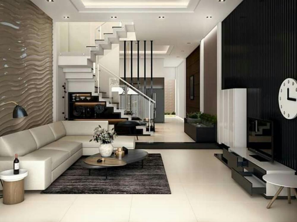 Mẫu Nhà Phố 2 Tầng Đẹp Diện Tích 5x15m với phòng khách tối giản, nội thất đặt sát tường và sử dụng kệ treo tường, tạo không gian sống thoáng đãng