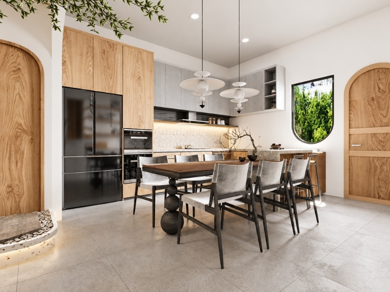 Mẫu bếp chữ L kết hợp bàn đảo đá terrazzo và bàn ăn chân trụ tròn phong cách Wabi Sabi