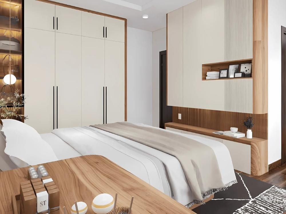 Phòng ngủ chung cư 40m2 với bộ chăn ga sáng và tủ quần áo âm tường