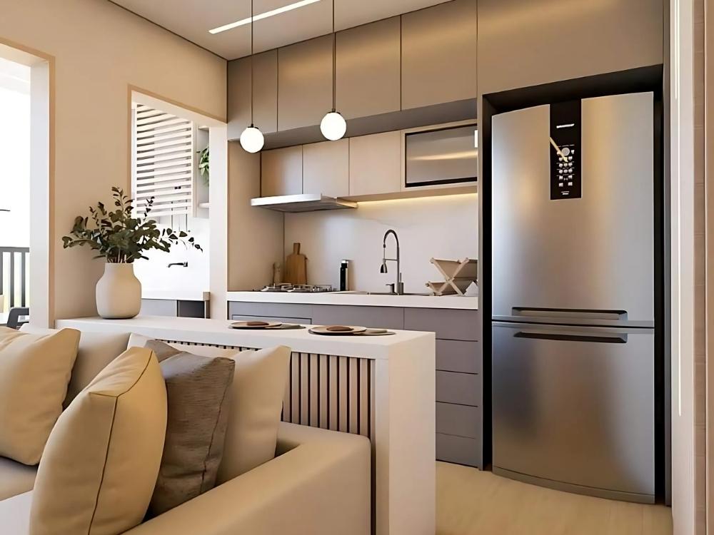 Phòng bếp chung cư 40m2 với tủ bếp gỗ sáng, mặt bàn đá trắng và thiết bị hiện đại giúp tối ưu hóa không gian.