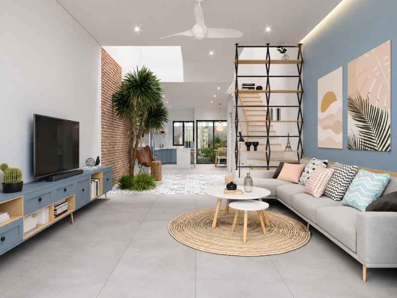 Nội thất phòng khách nhà phố 5x20 phong cách Scandinavian với tường xanh denim và thảm cói tròn