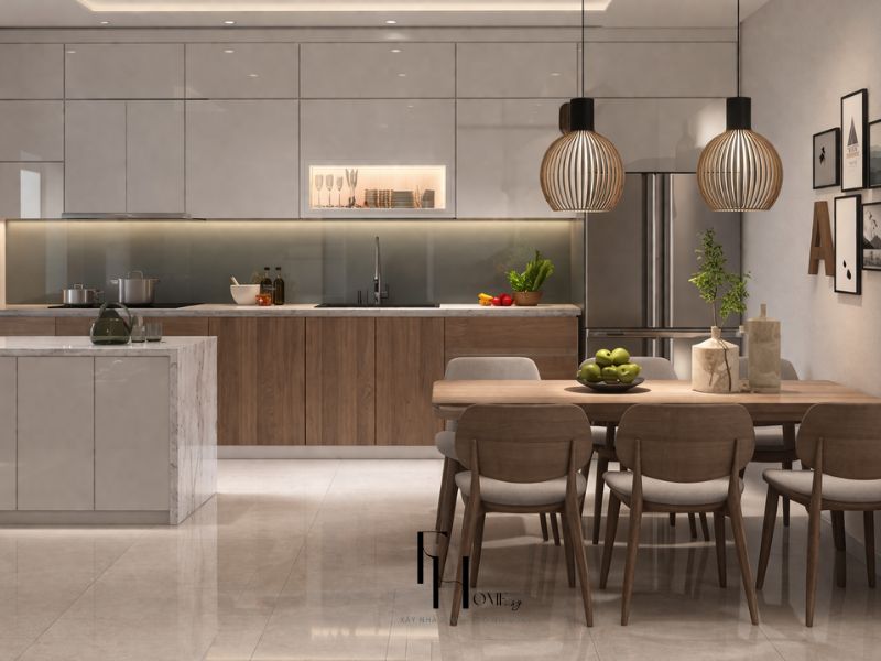 Phòng bếp chung cư 100m2 phong cách hiện đại tủ Acrylic xám kịch trần phối walnut đảo marble và bàn ăn gỗ 6 ghế đèn lồng gỗ