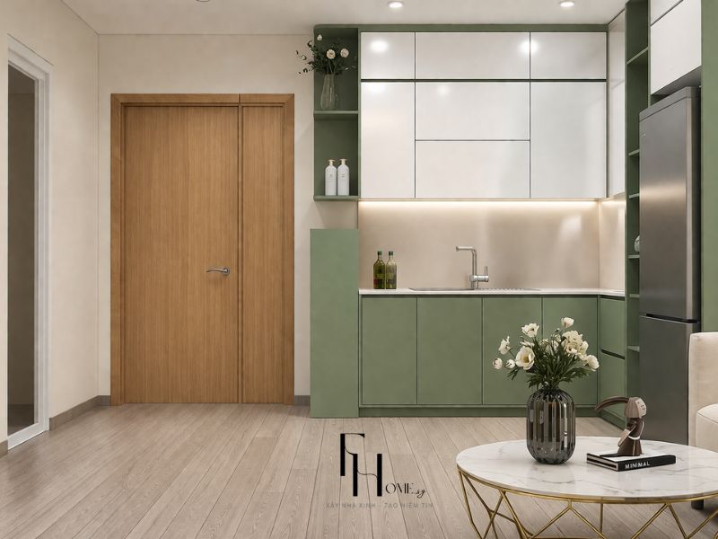 Phòng bếp chung cư 55m2 bố cục chữ L với tủ trên trắng, tủ dưới xanh sage và hốc mở kính đèn hắt chiếu sáng mặt bếp
