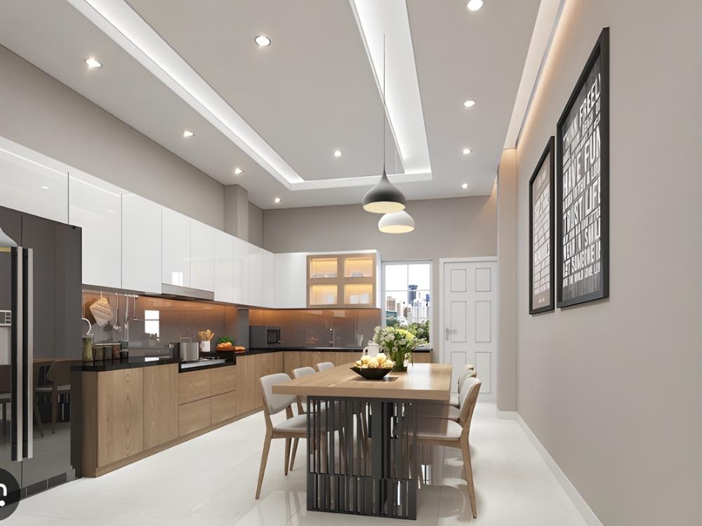 Phòng bếp hiện đại với đảo bếp đa chức năng, máy hút mùi âm trần và bếp từ tích hợp