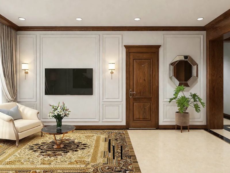 Phòng khách chung cư 100m2 phối hợp màu sắc và đèn trang trí tường phào chỉ trắng đèn tường đôi chụp vải chân đồng sofa kem khung gỗ chạm bàn trà marble đen và thảm Ba Tư vàng nâu