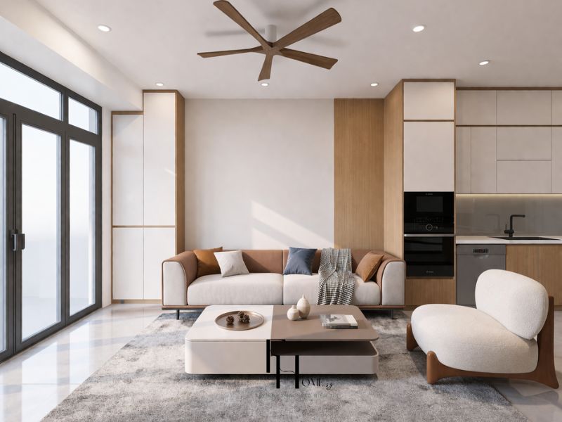 Phòng khách chung cư 100m2 phong cách scandinavian sofa vải be khung camel armchair bouclé trắng bàn trà trắng thảm len xám và quạt trần gỗ walnut