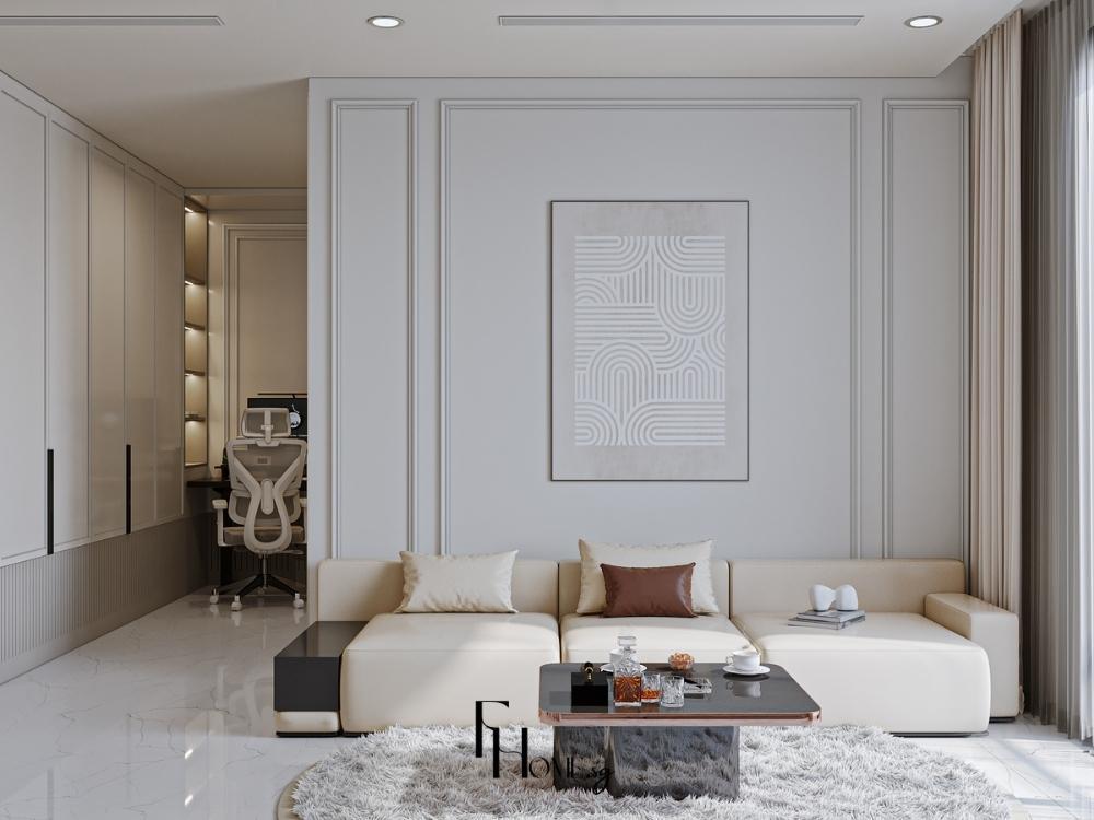 Phòng khách chung cư 45m2 phong cách Hiện đại với sofa da kem, tường phào chỉ xám trắng và góc làm việc tích hợp