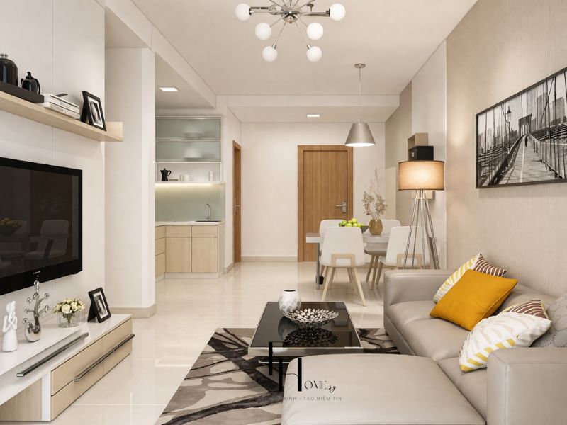 Phòng khách liền bàn ăn chung cư 55m2 với sofa chữ L be, bàn trà vuông kính đen và thiết kế mở liên thông bếp