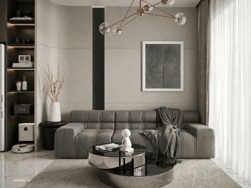 Phòng khách chung cư 60m2 hai phòng ngủ với sofa xám, bàn trà inox và đèn chùm khung đồng vàng