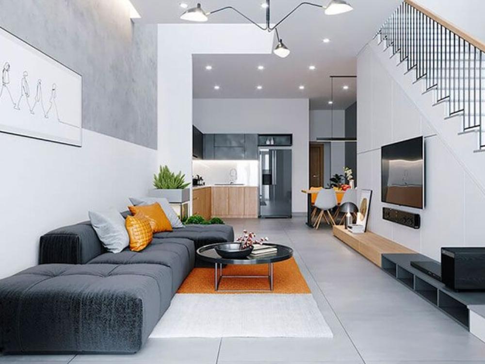 Phòng khách nhà phố 4 tầng diện tích dưới 100m², thiết kế hiện đại với sofa giường, tông màu sáng và cửa kính lớn đón sáng