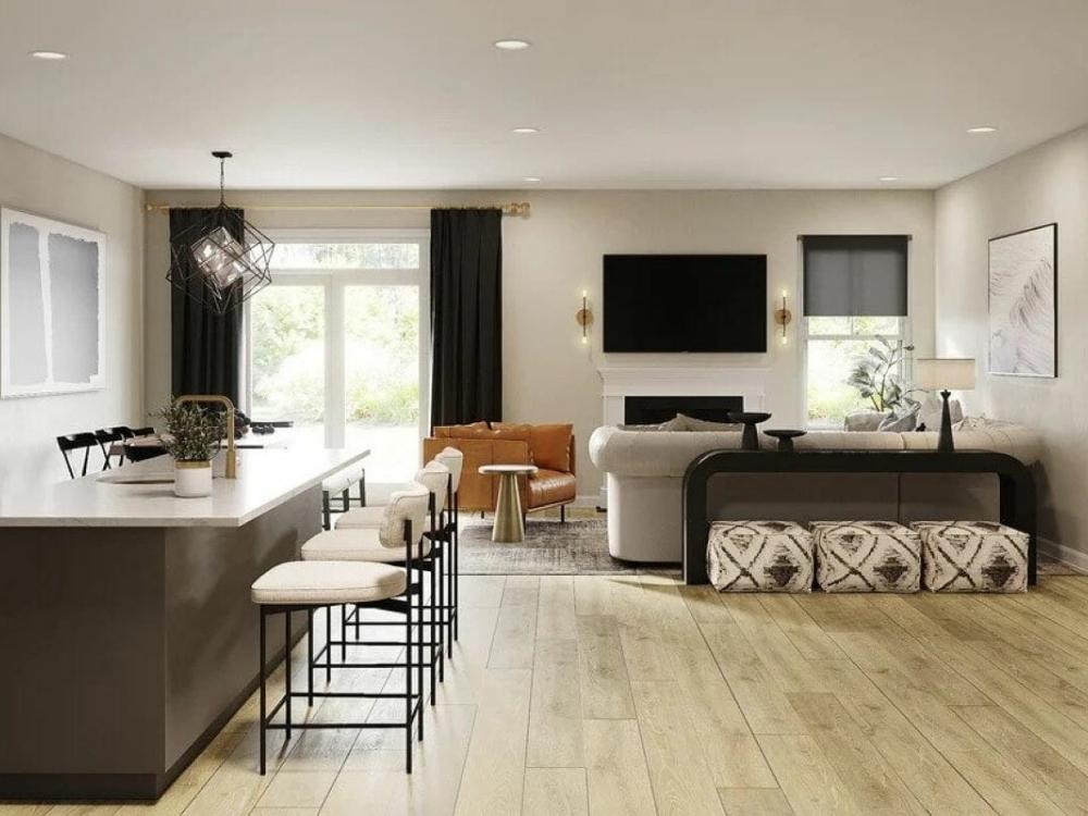 Phòng khách nhà phố 90m² 1 tầng với bố trí gọn gàng, nội thất áp sát tường, tạo lối đi thông thoáng và kết nối mở với các khu vực khác