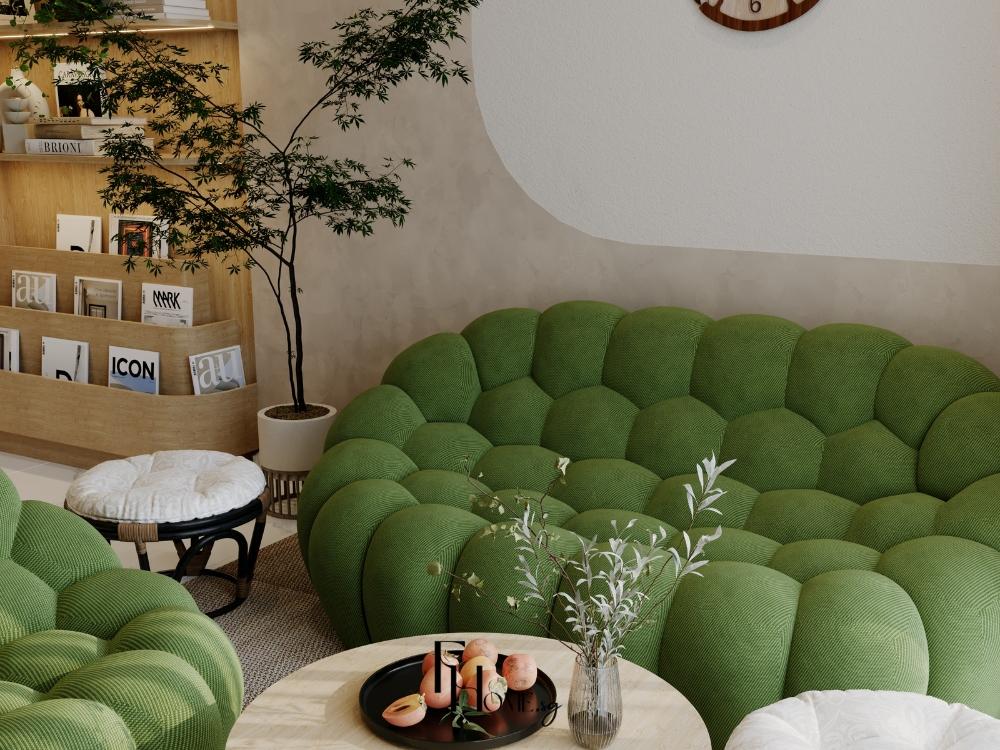 Phòng khách phong cách Tropical với sofa xanh lá, thảm be