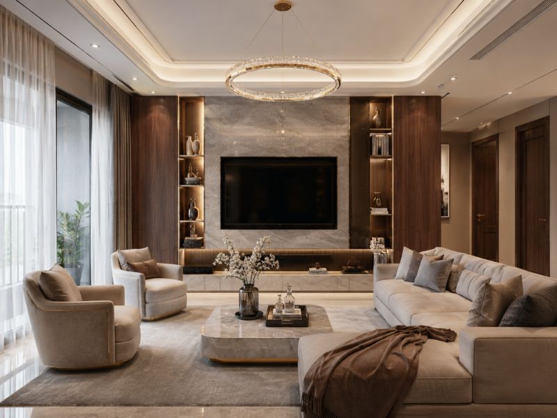 Phòng khách phong cách thiết kế nội thất chung cư Luxury với sofa lớn, bàn trà mặt đá, ốp tường đá và đèn chùm cao cấp