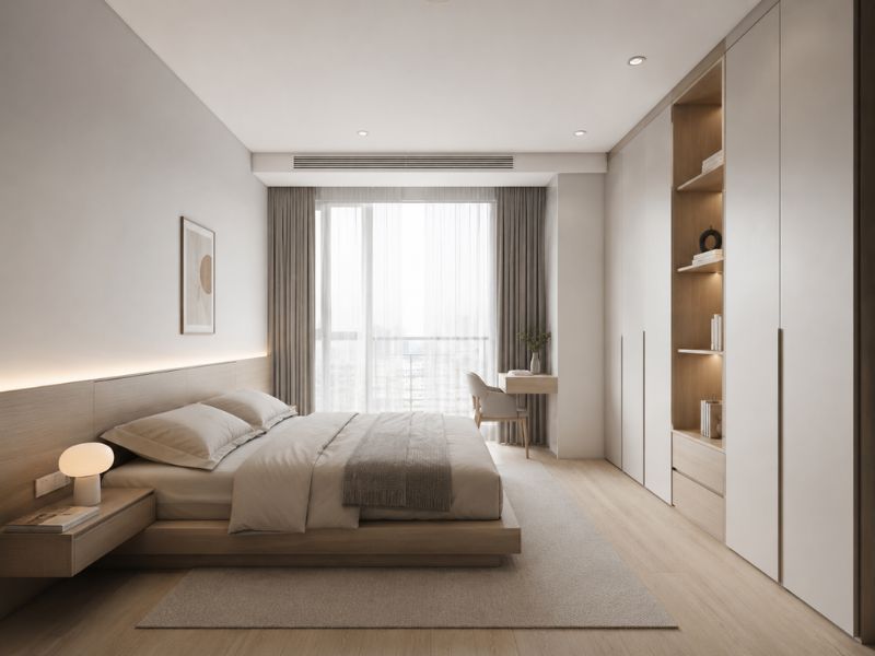Phòng ngủ phong cách thiết kế nội thất chung cư tối giản với giường thấp, tủ áo kịch trần và bàn làm việc cạnh cửa sổ