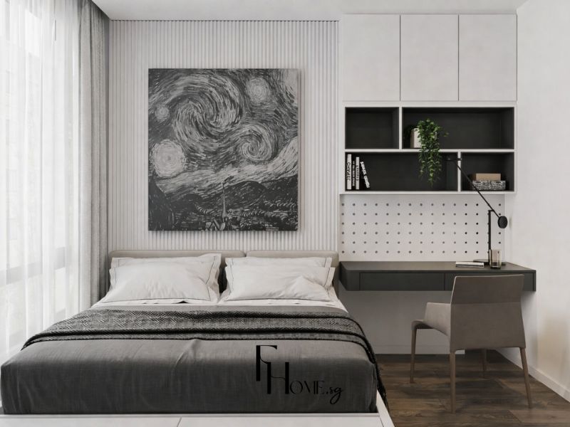 Phòng ngủ phụ chung cư 50m2 2 phòng ngủ với tường phào chỉ sọc dọc trắng, tranh nghệ thuật đen trắng khổ lớn và bàn làm việc treo tường tích hợp kệ tủ