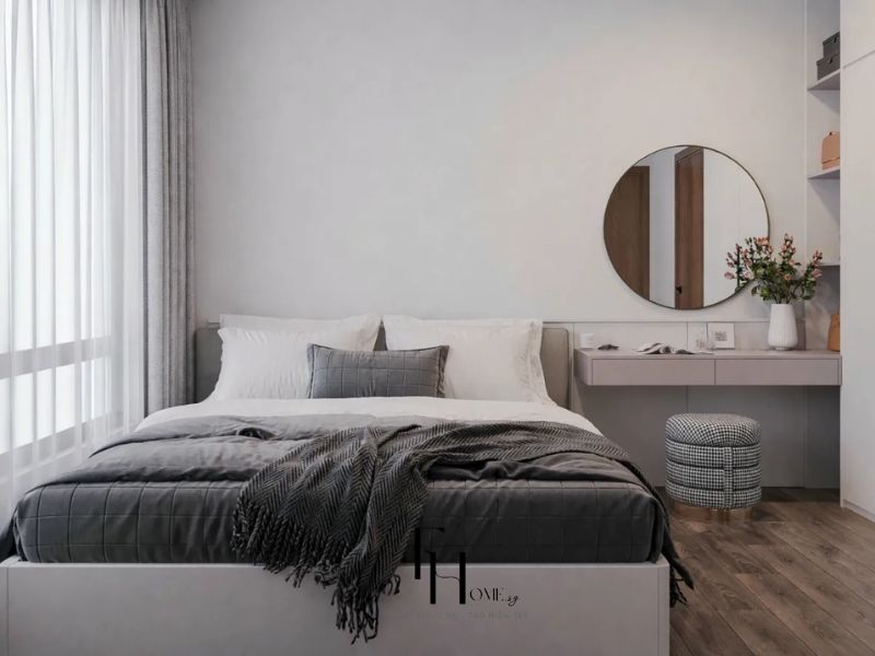 Phòng ngủ phụ chung cư 77m2 2 phòng ngủ bàn trang điểm treo tường gương tròn khung gỗ đôn tròn kẻ ca rô