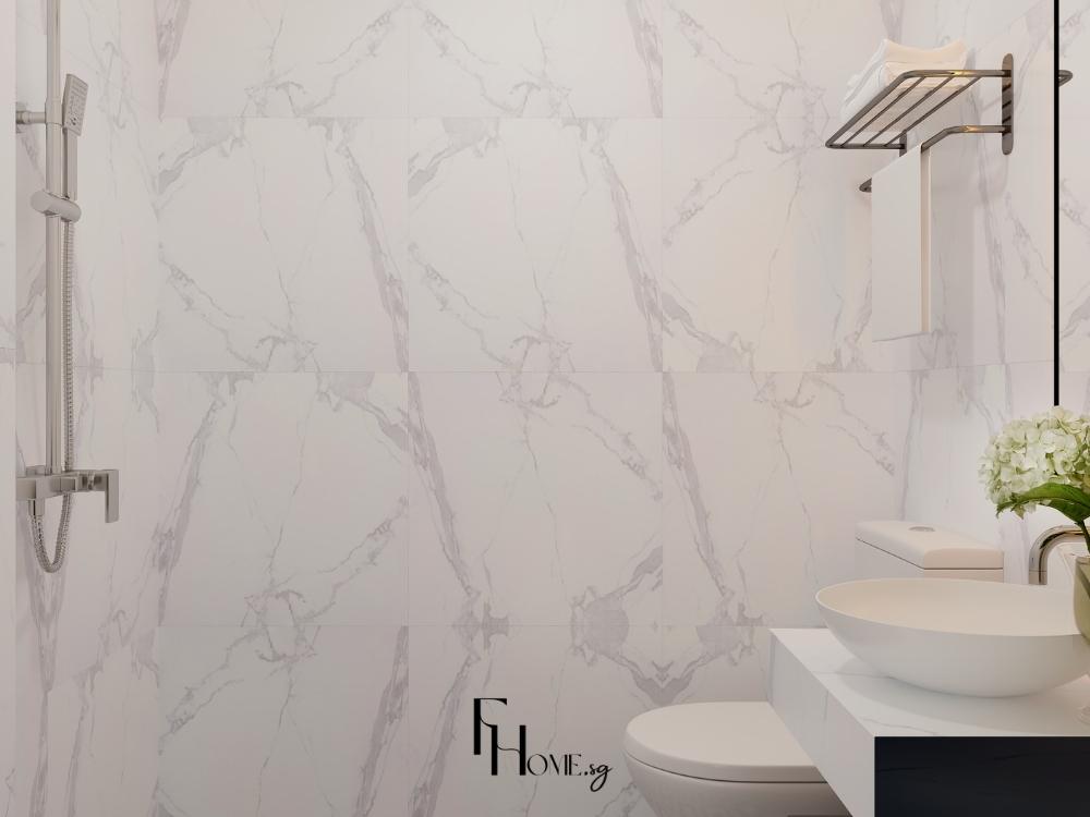 Phòng vệ sinh với gạch ốp sáng màu, tạo không gian rộng rãi và sạch sẽ