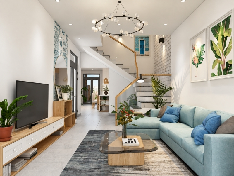 Thiết kế nội thất phòng khách nhà phố 5x20m bài trí sofa góc xanh mint giải phóng lối đi