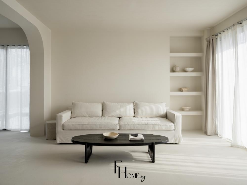 Thiết kế phòng khách phong cách tối giản với các đường nét tinh tế, sử dụng vật liệu bê tông và gỗ sáng