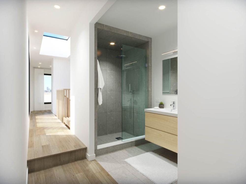 Thiết kế phòng vệ sinh nhà phố 4x10m 2 tầng với gạch bóng kiếng và kính ngăn trong suốt giúp không gian sáng và sạch sẽ