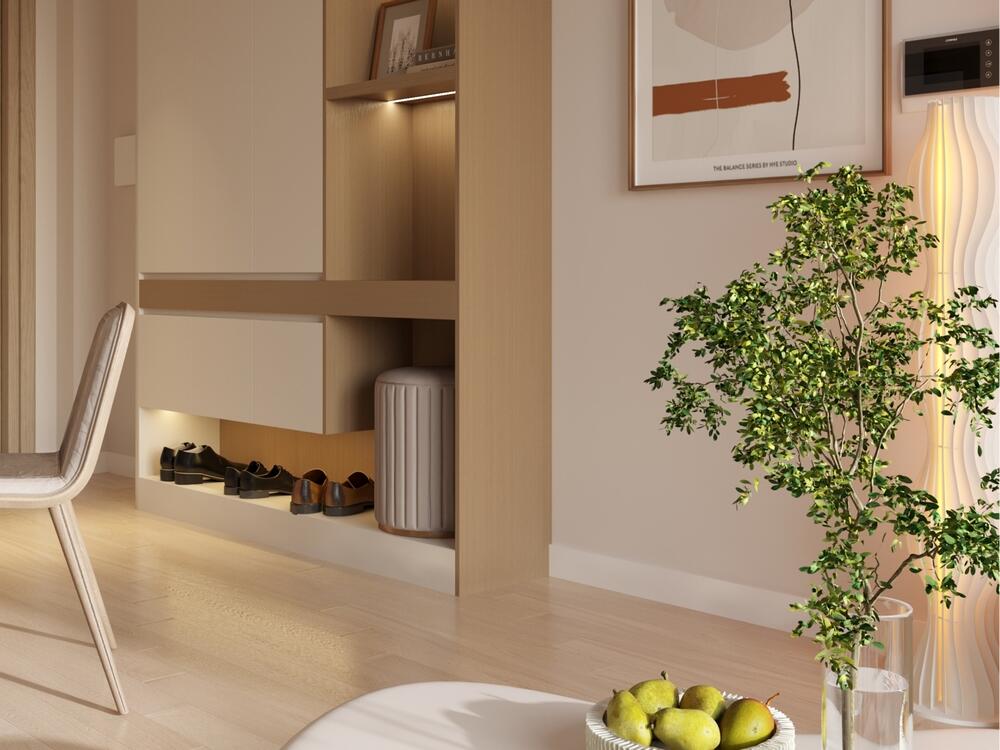 Khu vực tủ giày tối giản với kệ âm tường, ghế nhỏ và cây xanh trang trí