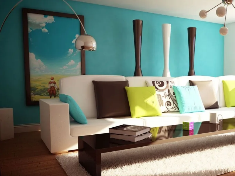 Nội thất phòng khách phong cách Funky có sofa sáng điểm gối nhiều màu trước tường xanh ngọc gắn đồ trang trí.