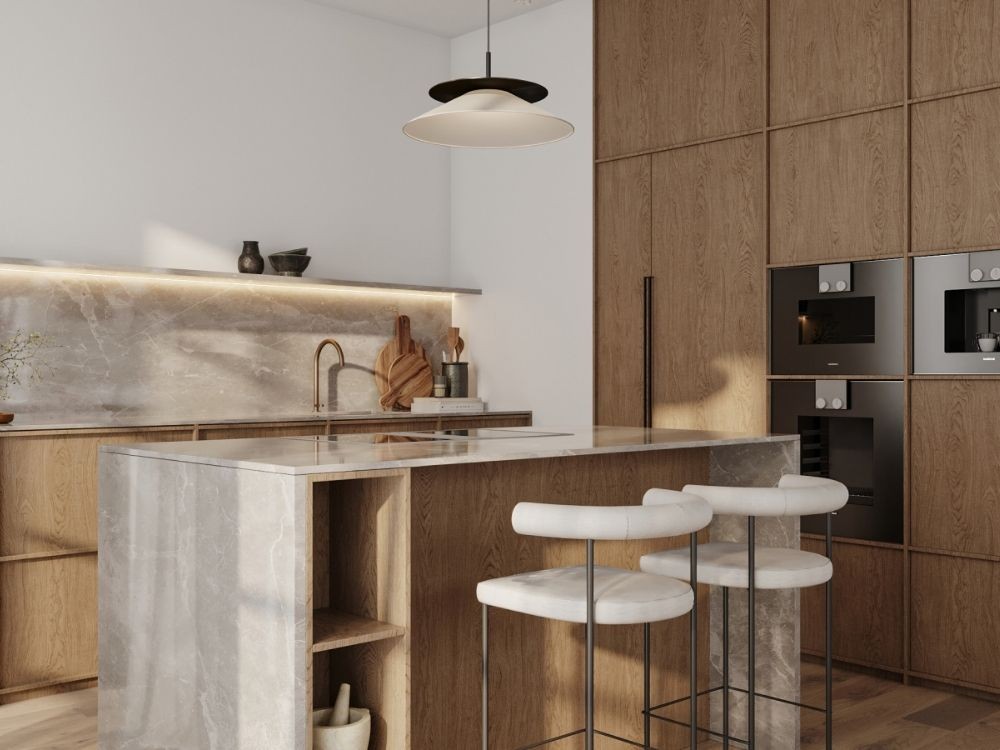 Phòng bếp Japandi với đảo bếp đá sáng, tủ gỗ cao cấp và ghế bar đệm trắng