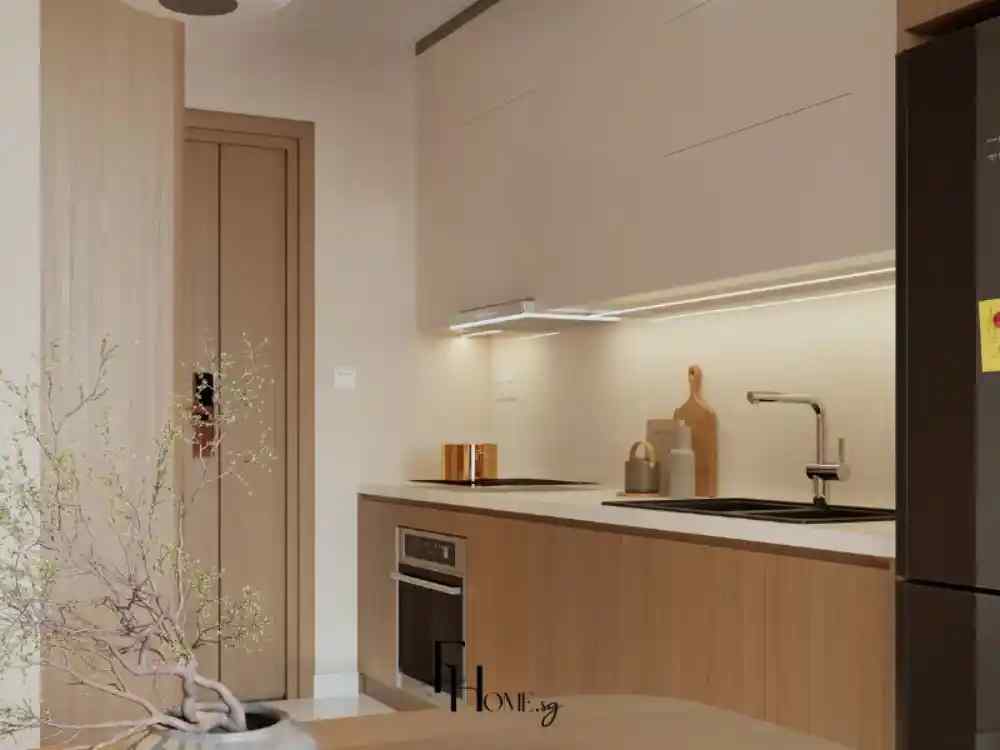 Phòng bếp phong cách Japandi với tủ bếp gỗ sáng, mặt đá trắng, đèn hắt nhẹ, cùng vật dụng trang trí tối giản