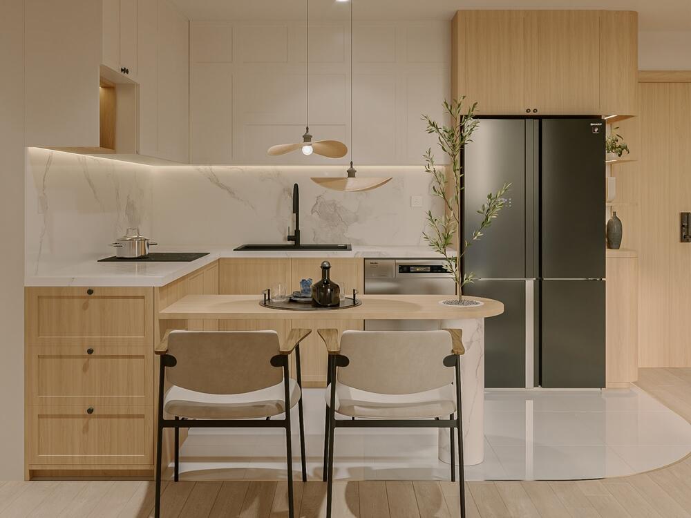 Phòng bếp tối giản với tủ gỗ sáng, bàn ăn tích hợp và đèn thả trang trí nhẹ nhàng