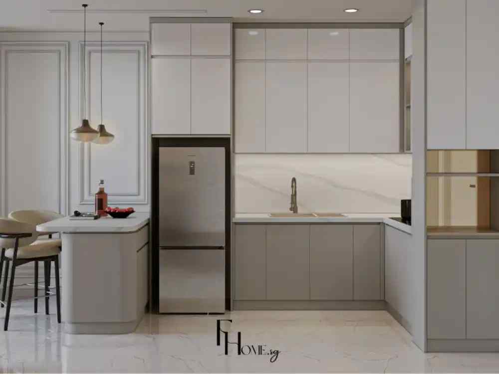Phòng bếp tông xám trắng, tủ lạnh inox đặt cạnh đảo bếp nhỏ, có hai ghế bar và đèn thả đôi