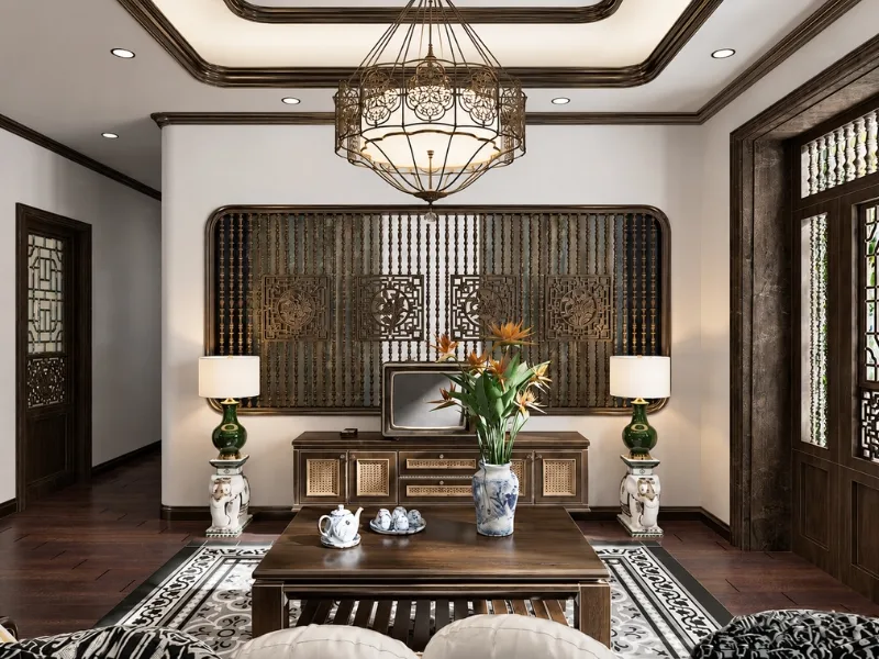 Phòng khách phong cách Đông Dương bố trí bàn ghế đối xứng dưới đèn chùm trước vách gỗ nan.