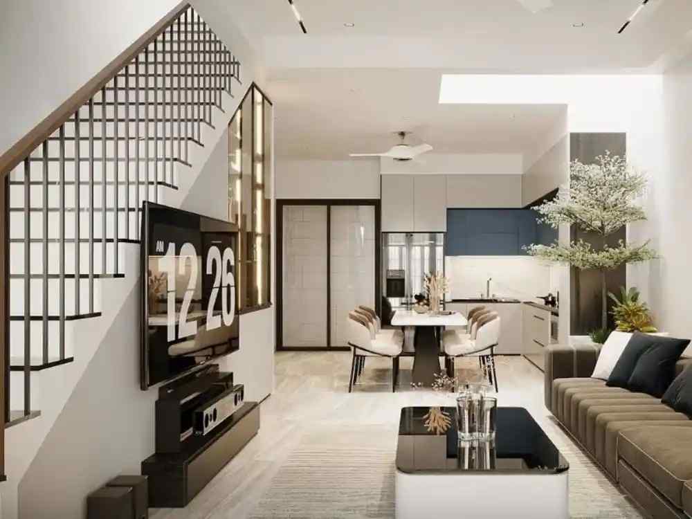 Phòng khách hiện đại tông xám trắng, sofa nâu nhung, bàn kính đen, cây xanh và ánh sáng dịu tinh tế