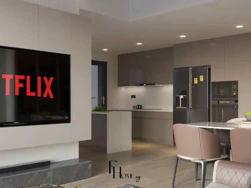 Phòng khách liền bếp phong cách hiện đại, phối tông xám nâu chủ đạo, với sofa gọn gàng, bàn ăn nhỏ