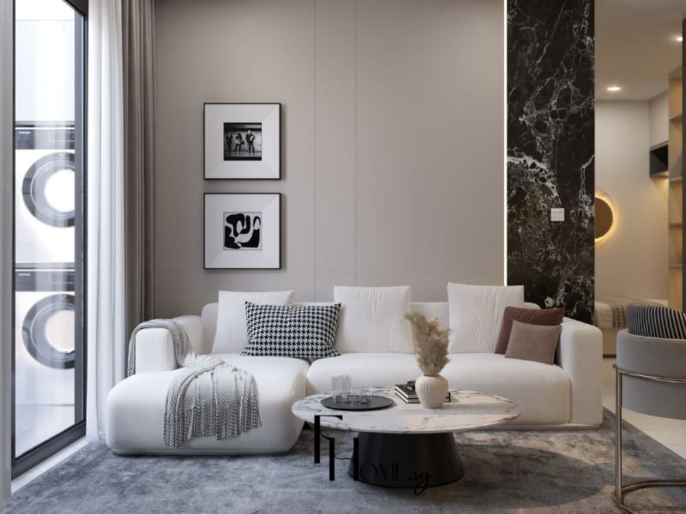 Phòng khách phong cách hiện đại với sofa trắng, bàn tròn mặt đá, tường ốp đá đen vân trắng