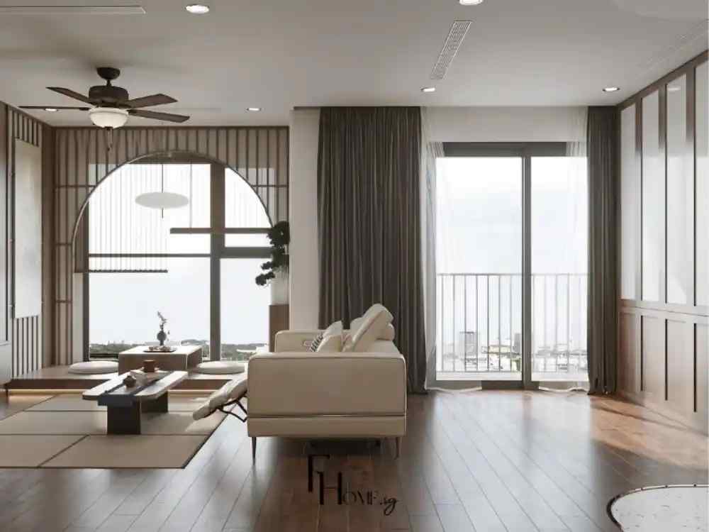 Phòng khách phong cách Nhật Bản với sofa sáng màu, sàn gỗ nâu và ánh sáng tự nhiên từ cửa kính lớn
