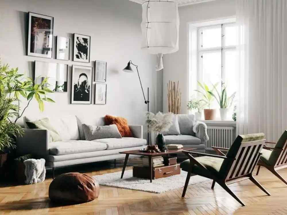 Phòng khách theo phong cách Bắc Âu với tông xám sáng, sofa vải bố, bàn gỗ thấp và cây xanh cạnh cửa sổ