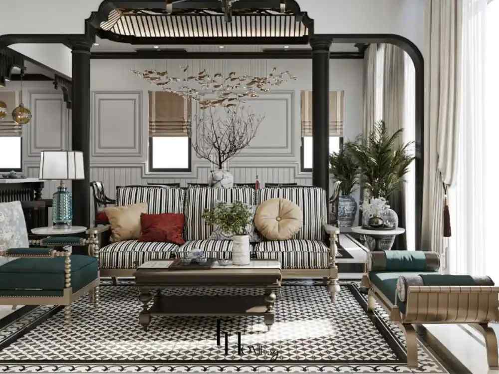 Phòng khách theo phong cách Indochine với sofa sọc đen trắng, bàn trà gỗ tối màu và trần gỗ chạm khắc kết hợp ánh sáng tự nhiên