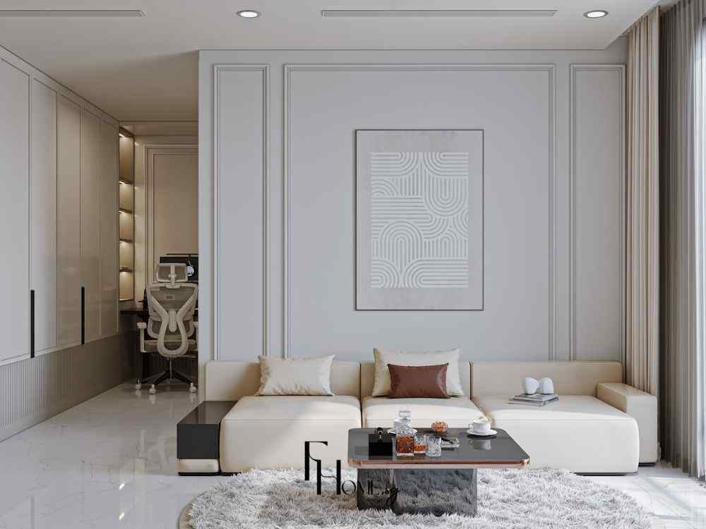 Phòng khách tông sáng với sofa chữ L màu kem, thảm lông, bàn nước đen