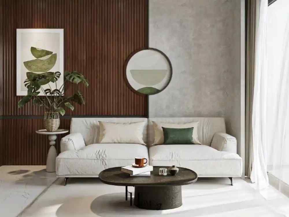 Phòng khách với ghế sofa màu kem, bàn trà tròn đen, tường gỗ nâu kết hợp bê tông xám