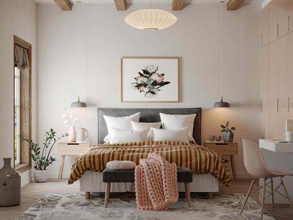 Phòng ngủ phong cách Bắc Âu, giường xám, chăn nâu kẻ sọc, tranh hoa treo tường và cây xanh