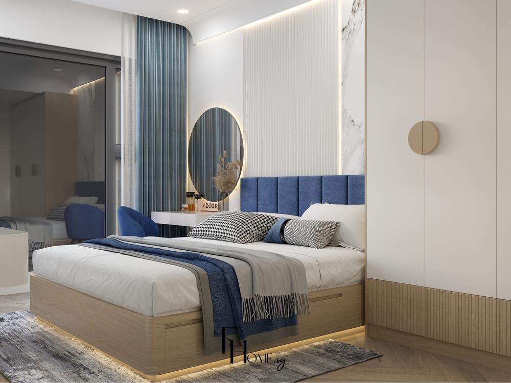 Phòng ngủ tối giản với giường bọc vải xanh, đèn hắt sáng và tủ trắng gỗ