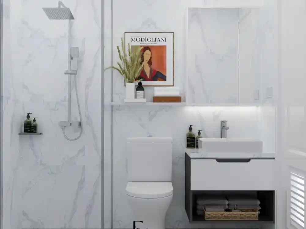 Phòng tắm hiện đại pha Wabi Sabi với tường vân đá trắng, kệ lavabo tối giản và ánh sáng dịu