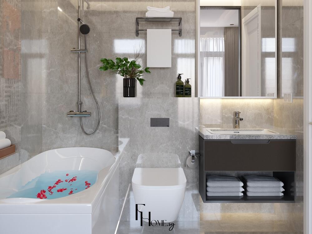 Phòng tắm phong cách Nhật Bản với bồn tắm bo cong, tường ốp đá xám bóng và điểm nhấn cây xanh