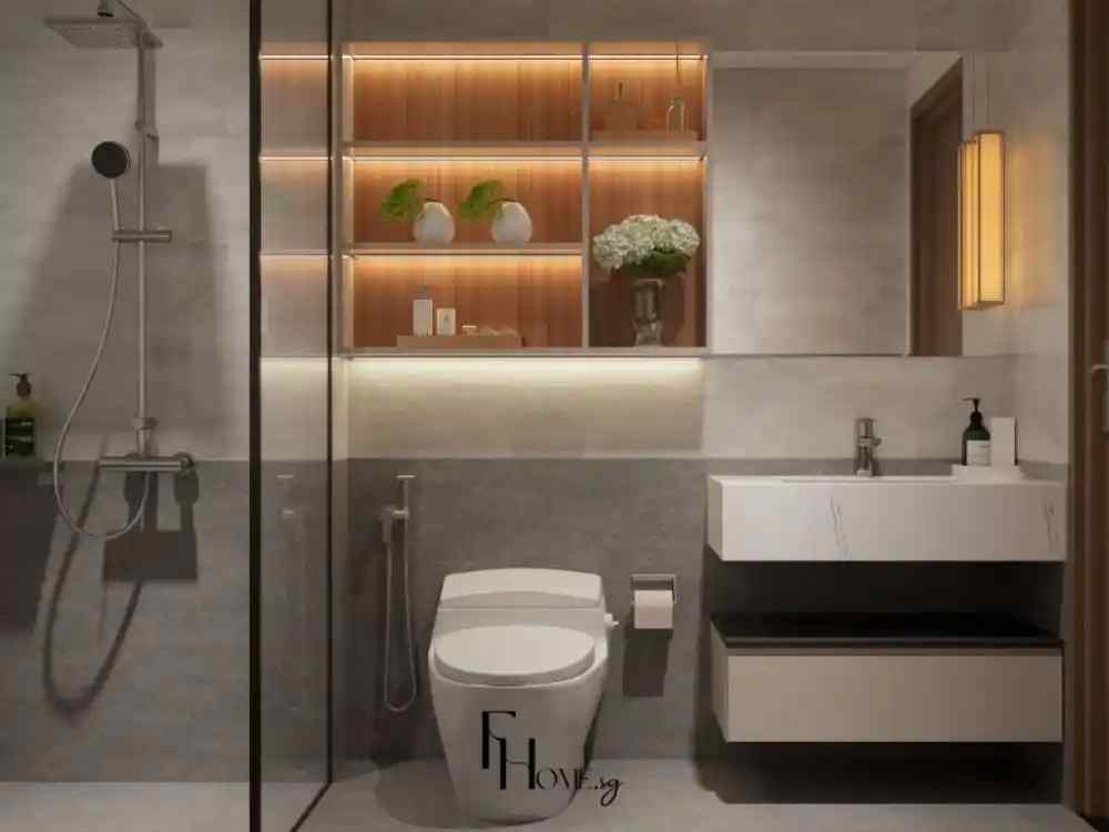Phòng tắm tone sáng với lavabo trắng, tủ gỗ ốp tường và đèn hắt ấm áp