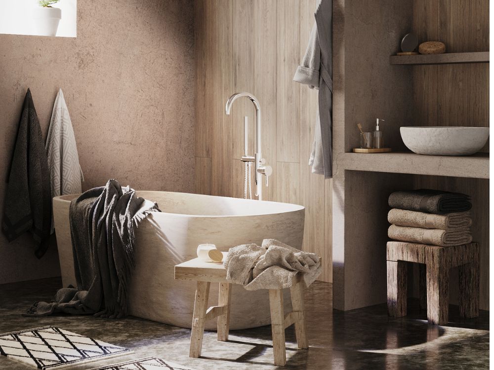 Phòng tắm Wabi Sabi mộc mạc với bồn đá thô, ghế gỗ và ánh sáng tự nhiên dịu nhẹ từ cửa sổ