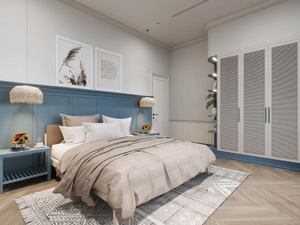 Không gian sử dụng gam màu xanh biển và trắng, kết hợp tranh tường sóng nước sinh động